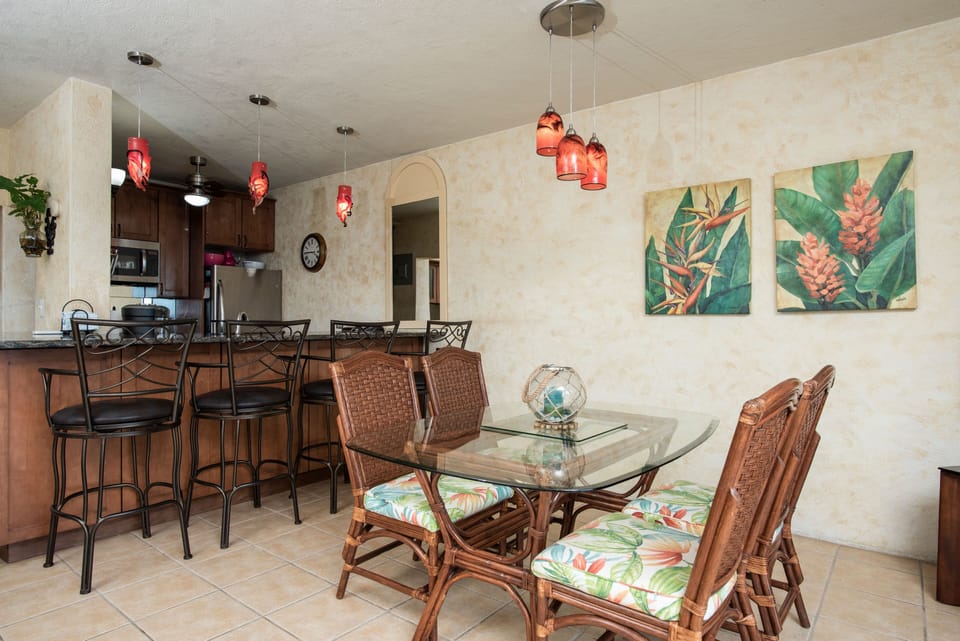 Dining area opens to eat at bar in kitchen.