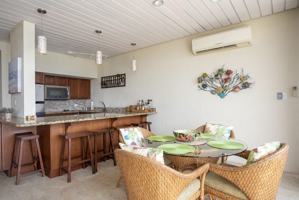 Beautifully renovated kitchen and dining area with seating for four and additional seating at the breakfast bar.