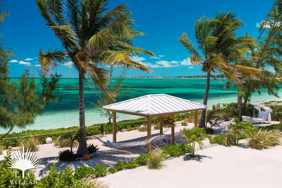 Private beachfront lounging area with covered and uncovered spaces. 