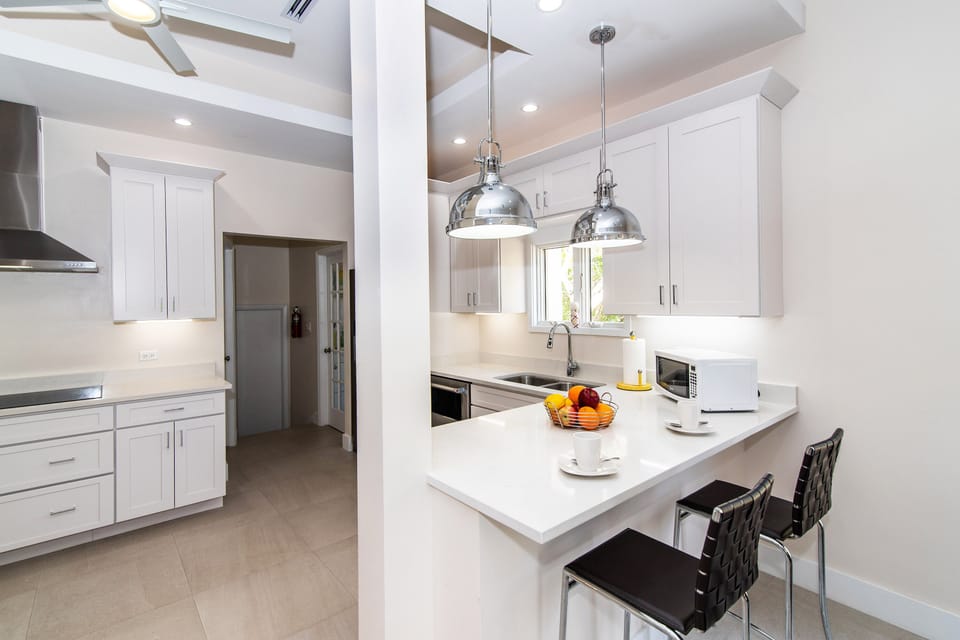 Newly renovated kitchen with modern appliances and plenty of cabinet space. 