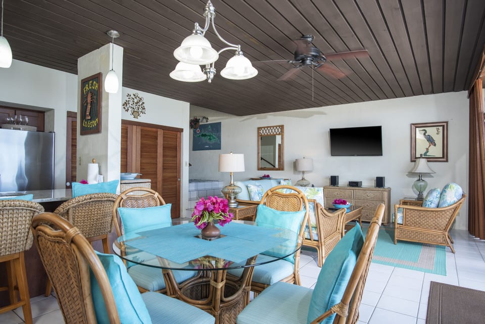 Open floor plan with living room opening to dining area all with