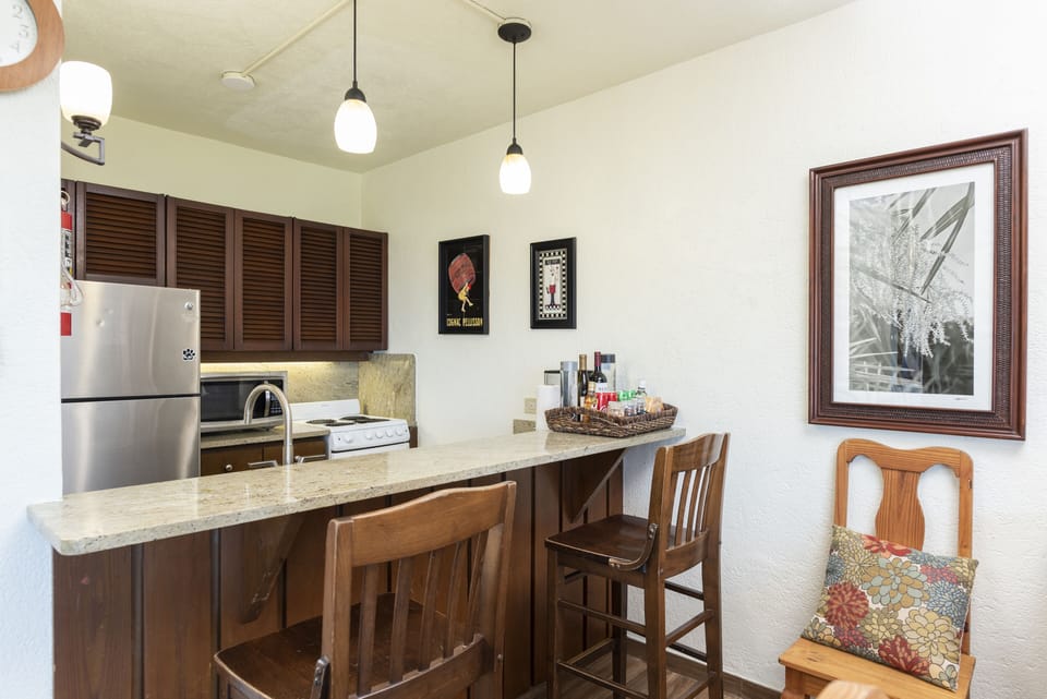 Extra bar stool seating at breakfast counter.