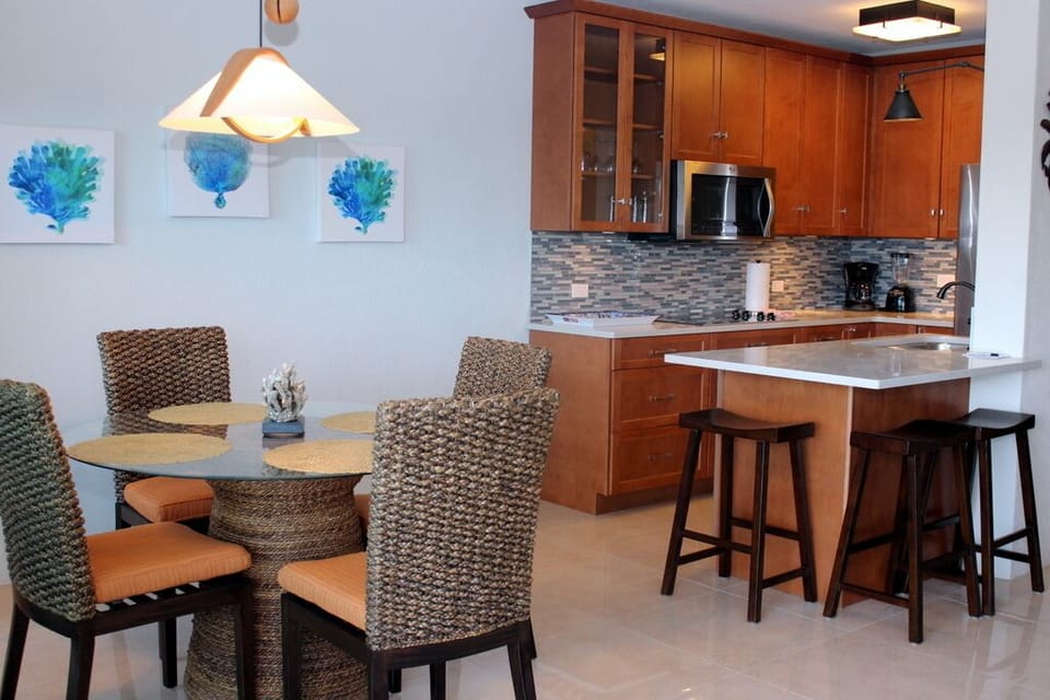 Indoor dining area opens to fully renovated kitchen.