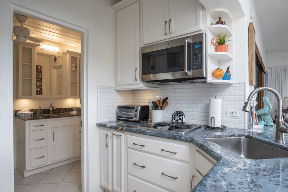 Access bathroom from kitchen or bedroom.