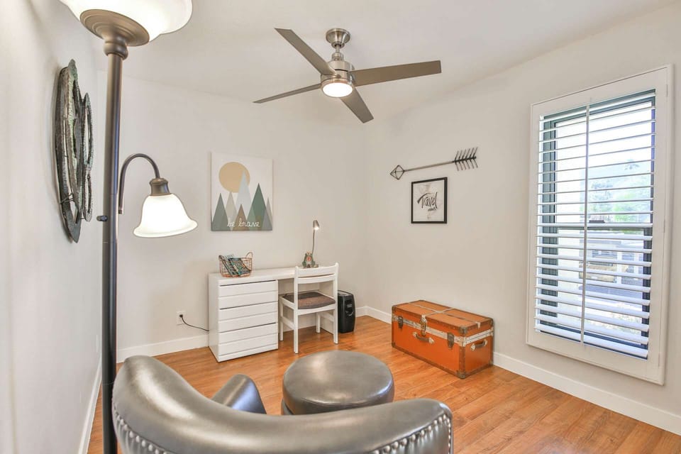 Bonus room on the second floor with desk, reading chair, and view to the West