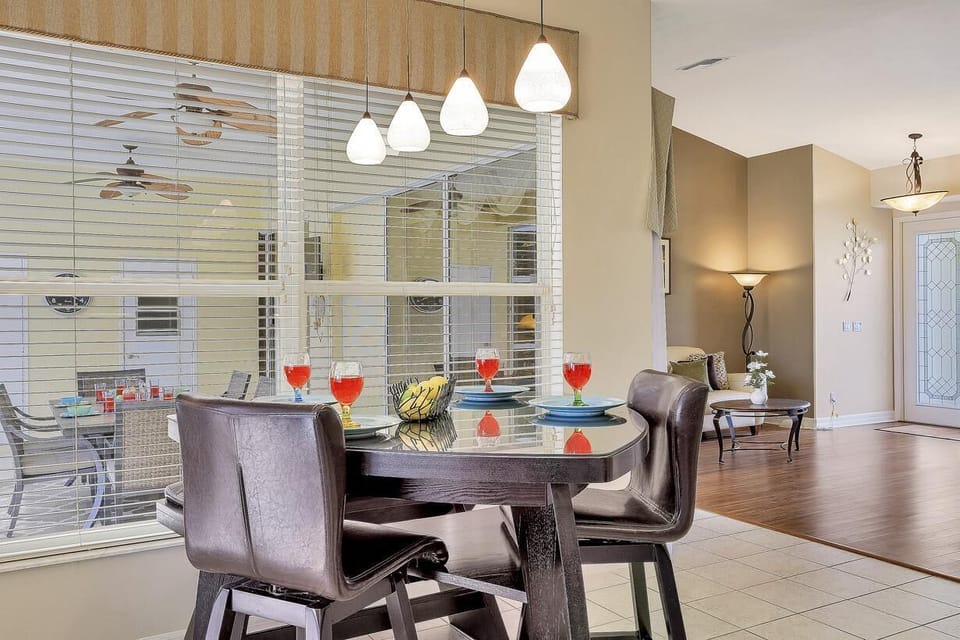 The casual Dining Area overlooks the pool deck plus the Kitchen and Living area