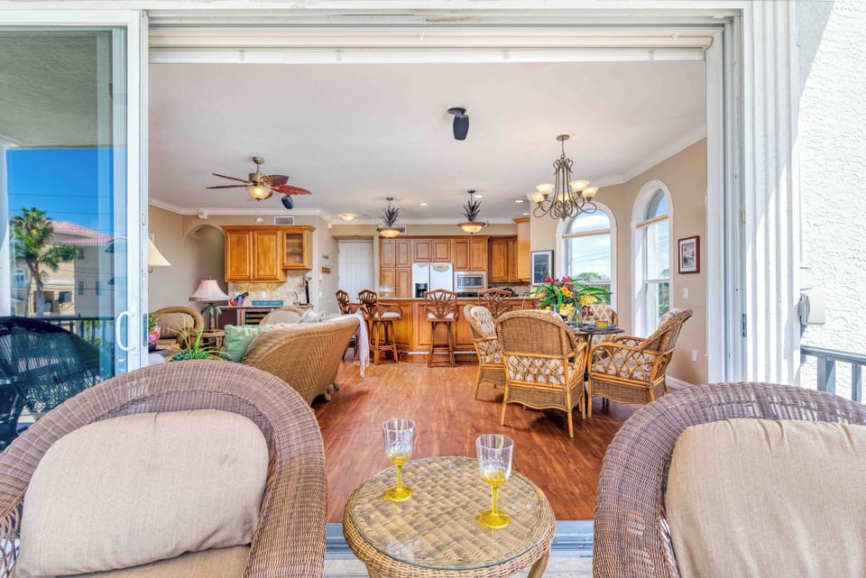 Slide open the doors and let the fresh air in—this inviting covered balcony flows seamlessly into the open-concept living, dining, and kitchen areas, creating the perfect space to gather, dine, and unwind together.