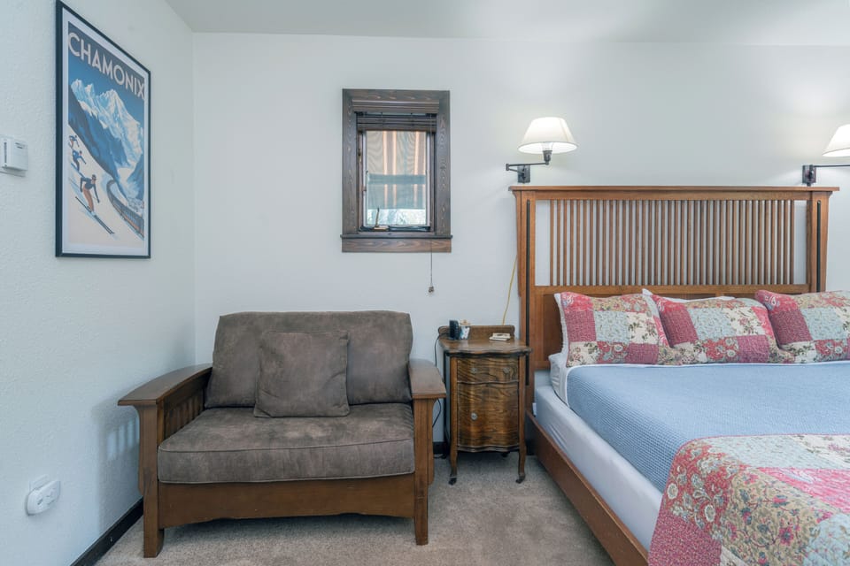 Relax into your private retreat, where vintage alpine charm meets modern comfort. Sink into the cozy armchair or unwind on your welcoming bed after a day of mountain adventures.