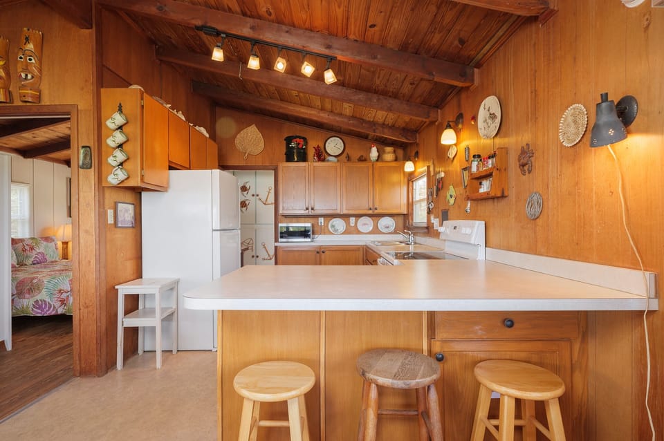 Fully Equipped Kitchen with Breakfast Bar Seating for Three
