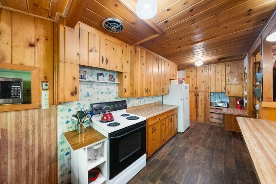 The kitchen is fully equipped and offers plenty of counter space - The kitchen is fully equipped and offers plenty of counter space for your cooking needs.