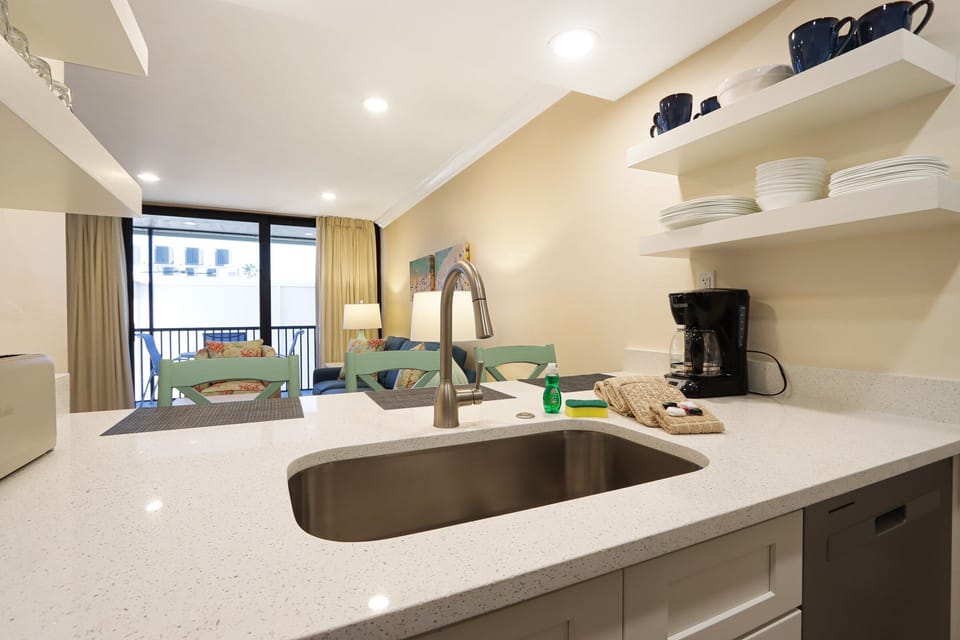 Open concept kitchen and floating shelves