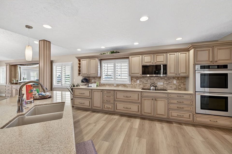 Kitchen with dual ovens and breakfast bar seating