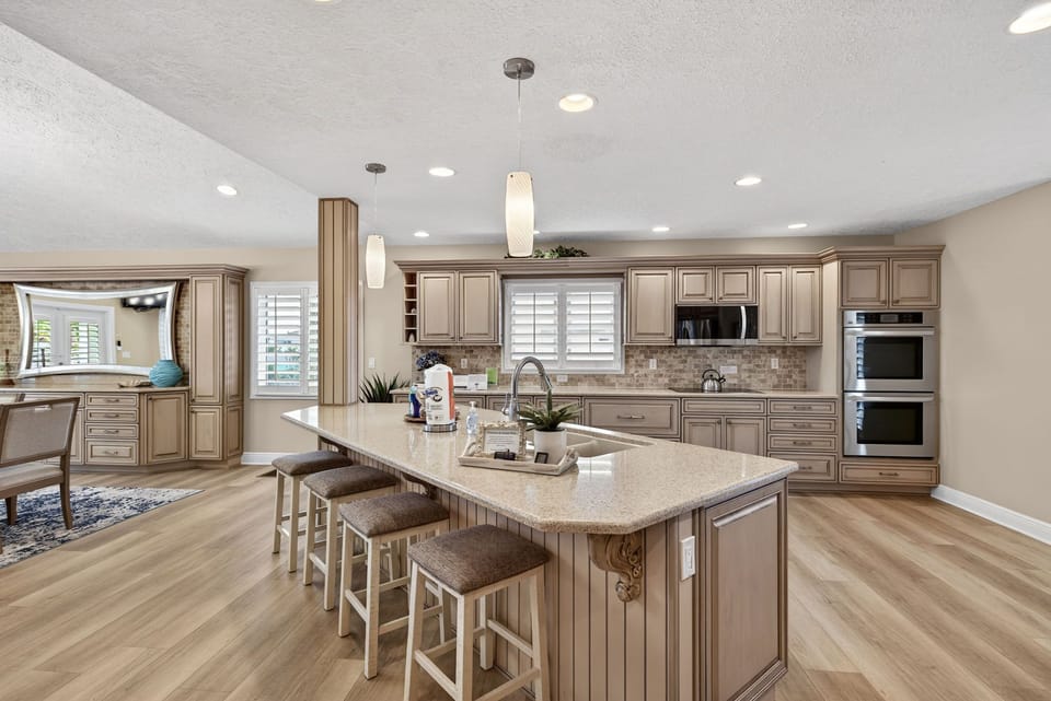 Kitchen with dual ovens and breakfast bar seating