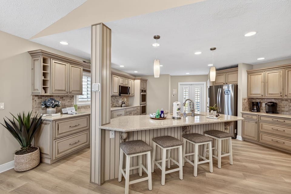 Kitchen with dual ovens and breakfast bar seating