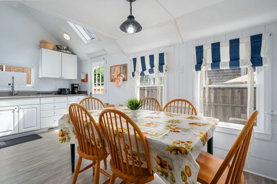 Dining table conveniently shares space with the kitchen and offers seating for six-17 Ocean Ave Harwich Port Cape Cod-Kare Not-NEVR