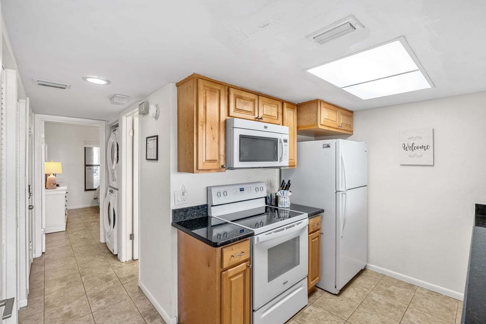 Prepare delicious meals in this bright kitchen with sleek granite counters