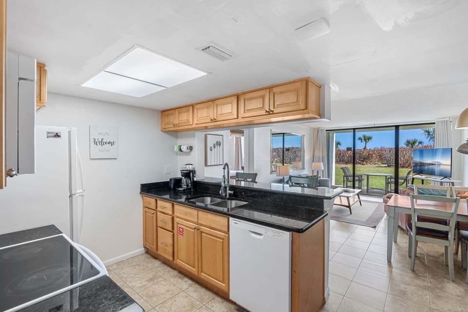 Cook with ease in this open kitchen while enjoying water views nearby