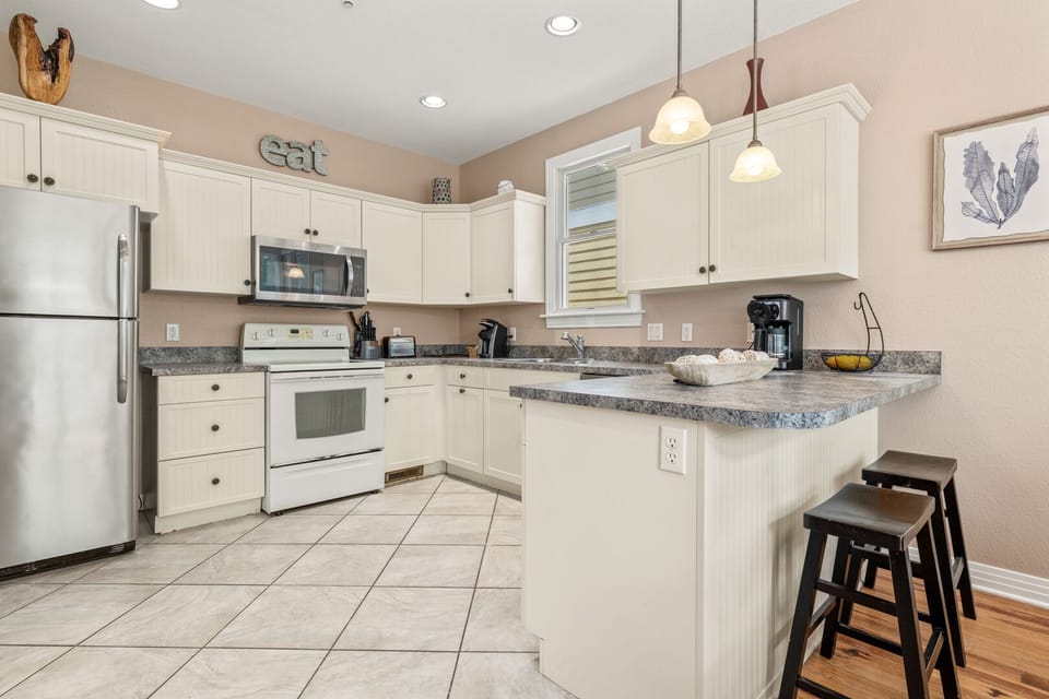 Kitchen with Bar Seating on First Level