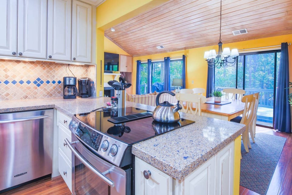 The kitchen looks opens onto the dining area.