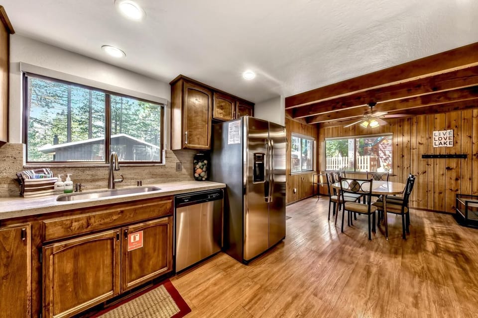Cook in your fully equipped kitchen with stainless steel appliances and gather around the dining table under exposed beams.