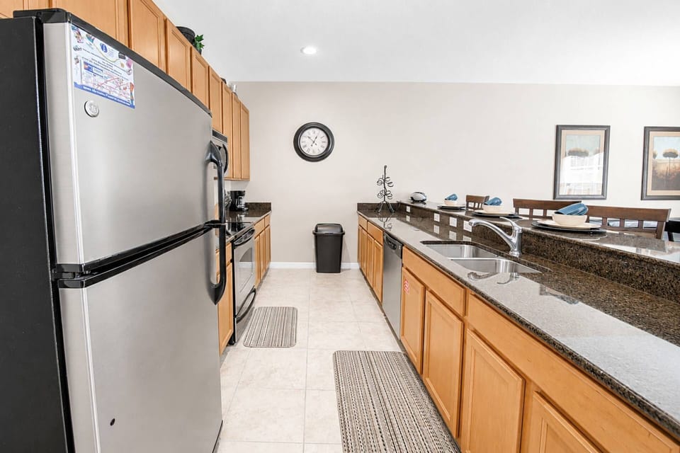 Fully equipped kitchen with granite counters and stainless steel appliances