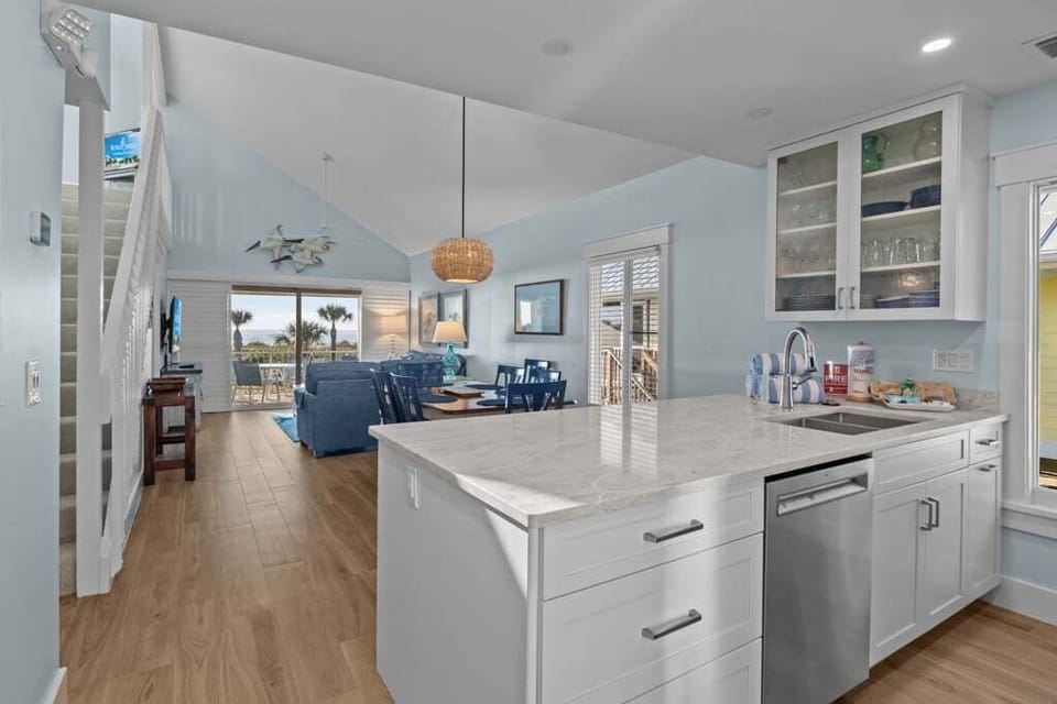 Open concept kitchen, dining, and living areas