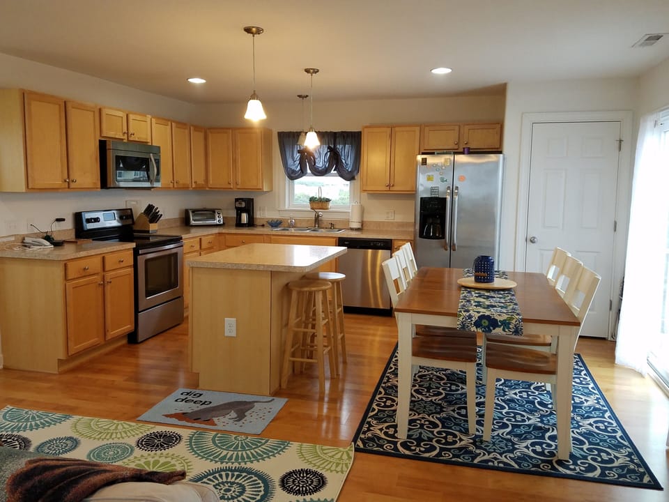 Kitchen and dining - Kitchen and Dining. Slider out to level 3 deck to the right in the picture