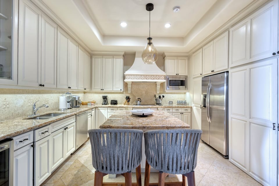 This bright, spacious newly remodeled kitchen has everything you need to prepare your favorite meals, with modern appliances, ample counter space, and a welcoming island perfect for gathering.