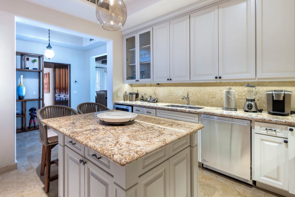 Your gourmet kitchen awaits with gleaming granite counters, a spacious center island for gathering, and every appliance you'll need to cook and entertain in style.