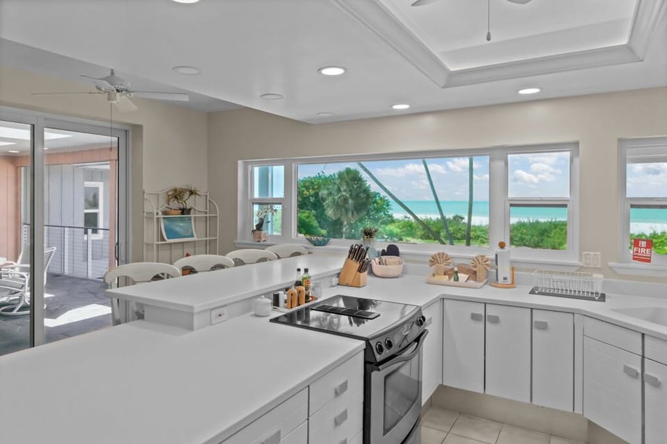 Kitchen with stainless steel appliances and breakfast bar