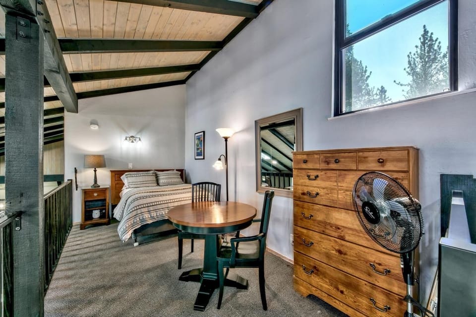 Upstairs loft with full bed, shares mid-level bathroom