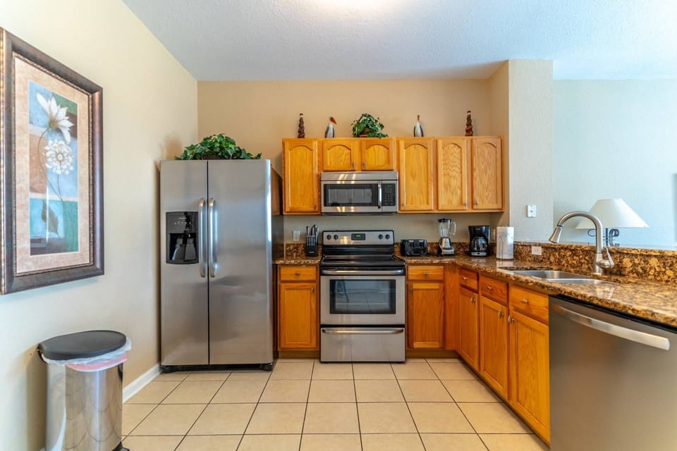 Stainless Steel Appliances and Granite Counter Tops Grace This Kitchen Area
