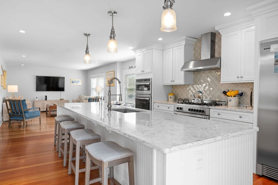 After entering you are in the kitchen which is open to the family room beyond - 388 Main Street Chatham Cape Cod - The Priscilla House