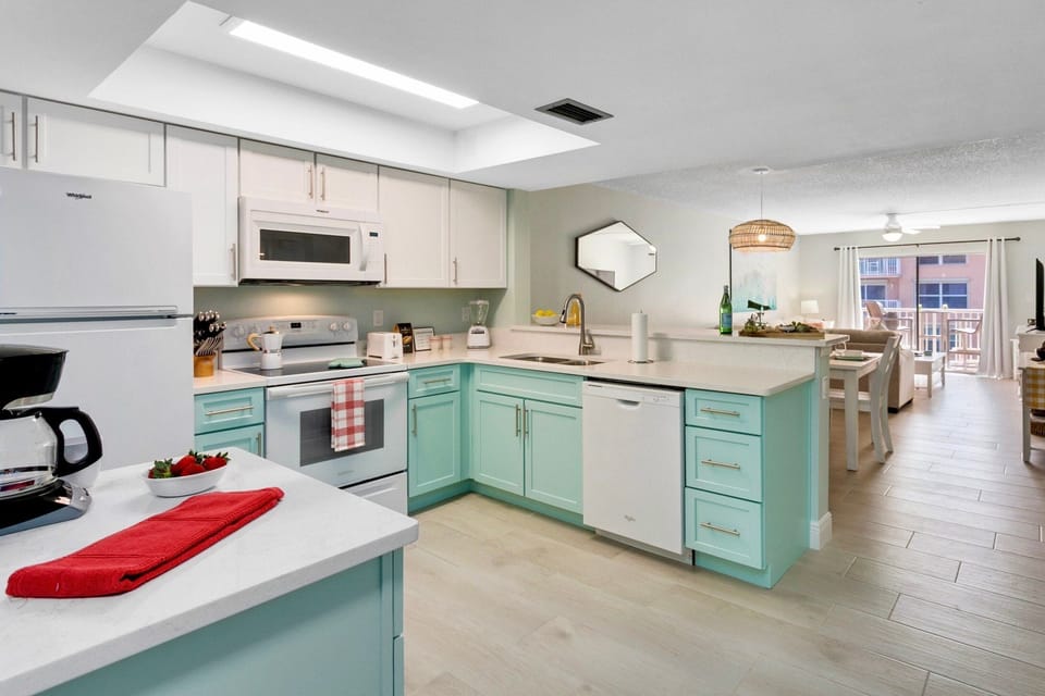 Fully stocked bright kitchen.
