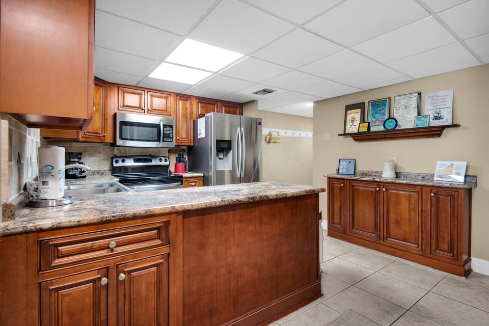 Discover the joys of cooking in this fully equipped kitchen, featuring modern updates and top-of-the-line stainless steel appliances.