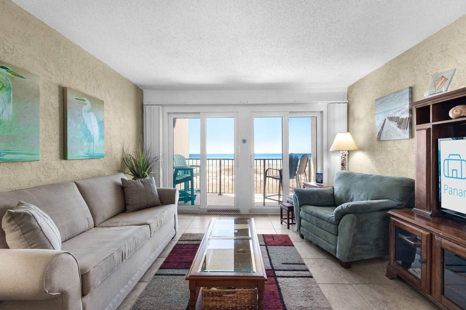 Step into the inviting living area, where you'll find a big screen tv and plush sleeper sofa perfect for relaxing or accommodating additional guests!