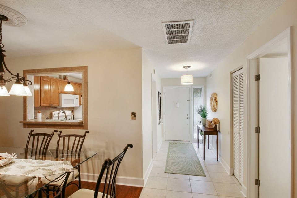The front door opens into the entryway, kitchen, dining area and guest bedroom.