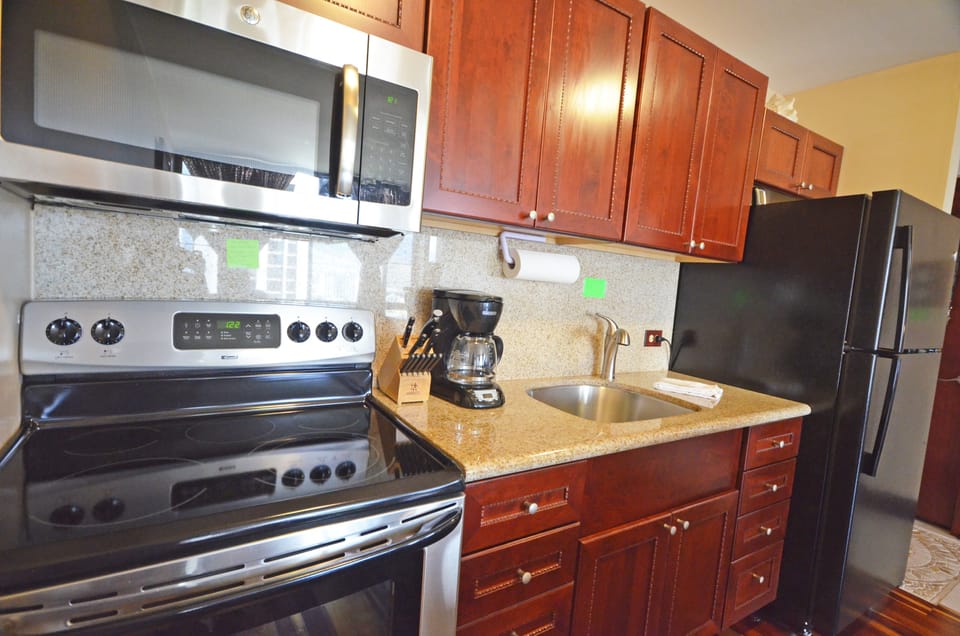 Full kitchen with a stove, microwave,and refrigerator