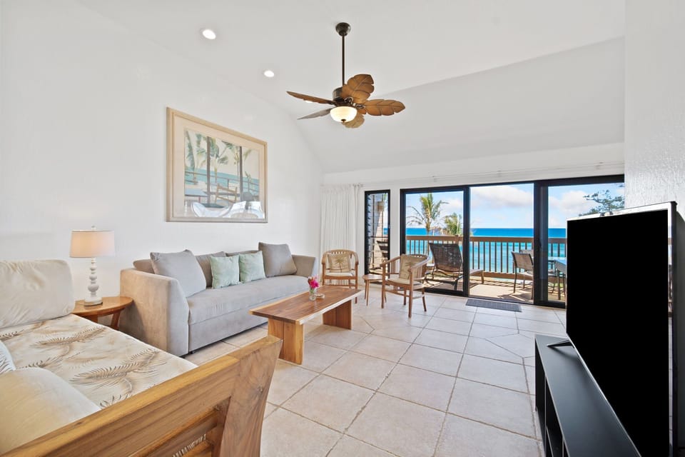Spacius living room with oceanfront views and cable/smart TV