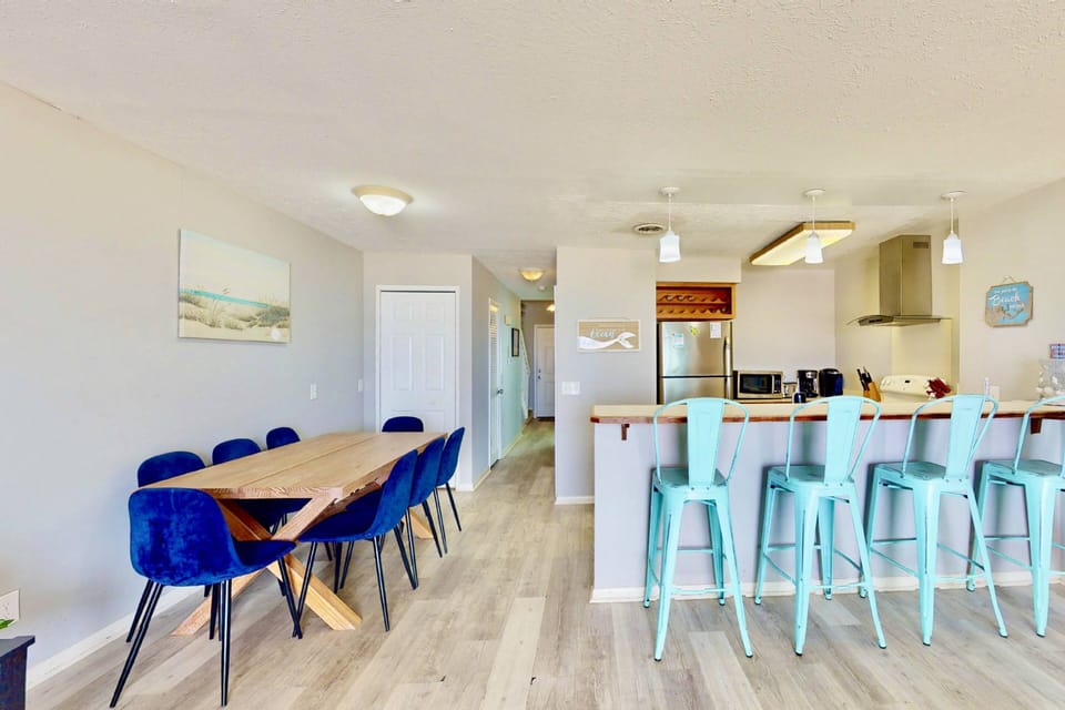 A large dining table and counter seating offer a spot for everyone