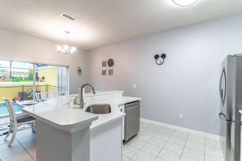 Open kitchen and dining area with access to the private pool