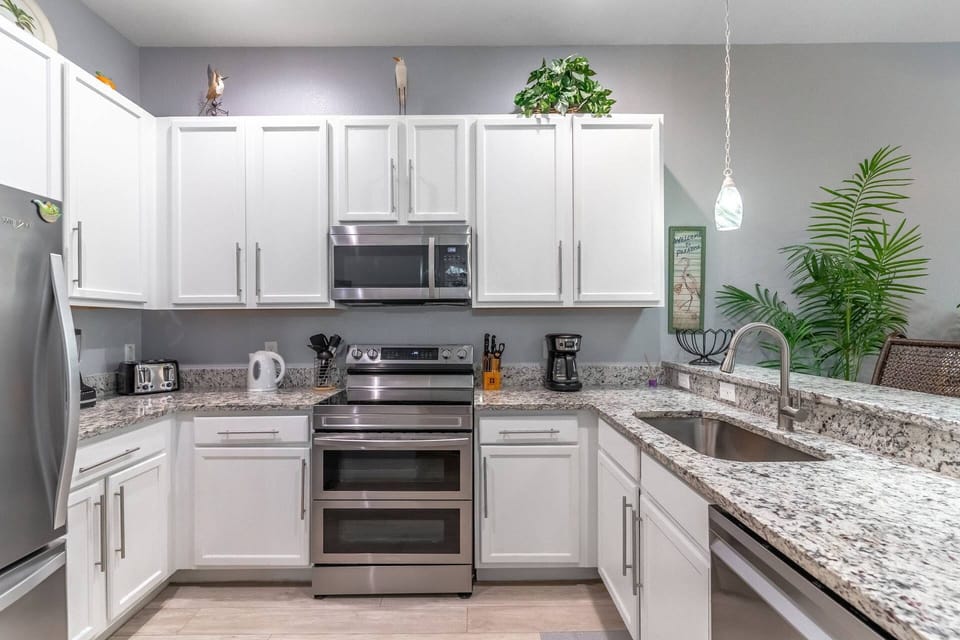 Fully equipped kitchen with granite counters and stainless steel appliances