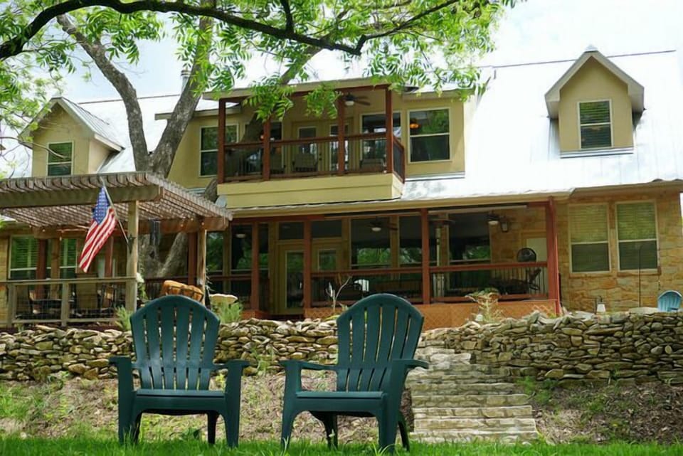 View of the back of the house and lower and upper decks