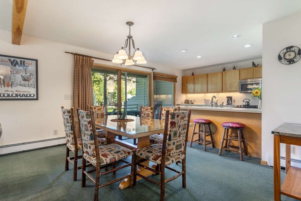 Dining room with seating for 6, breakfast bar with seating for 3 and deck access to the golf course.