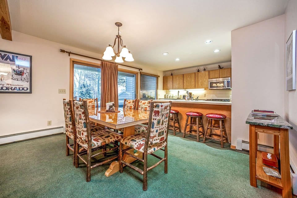 Dining room with seating for 6, breakfast bar with seating for 3 and deck access to the golf course.