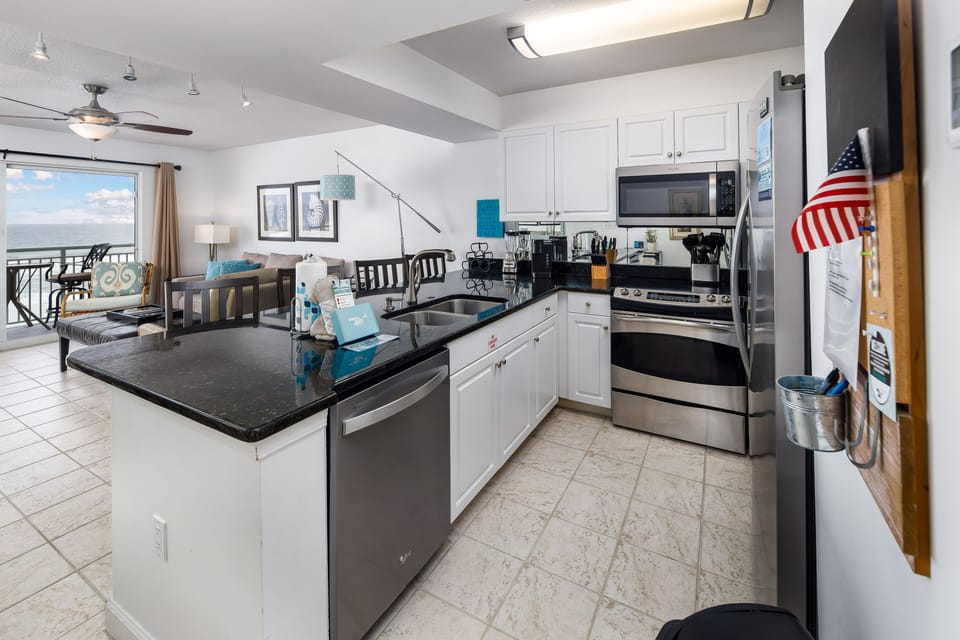 High-end stainless appliances in the fully stocked kitchen - Spacious and perfect for your gulf side chef!