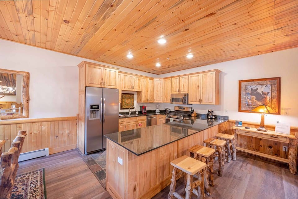 The home has an open concept floor plan has hardwood flooring throughout. The hardwood dining table can easily seat six (6). There are four additional