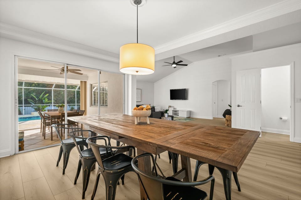 Large dining table perfect for family dinners, board games, or gathering after a day in the sun.