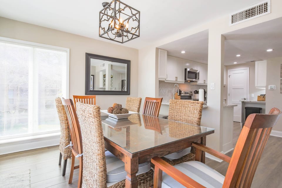 The dining area, which seats 8, opens into the renovated kitchen.