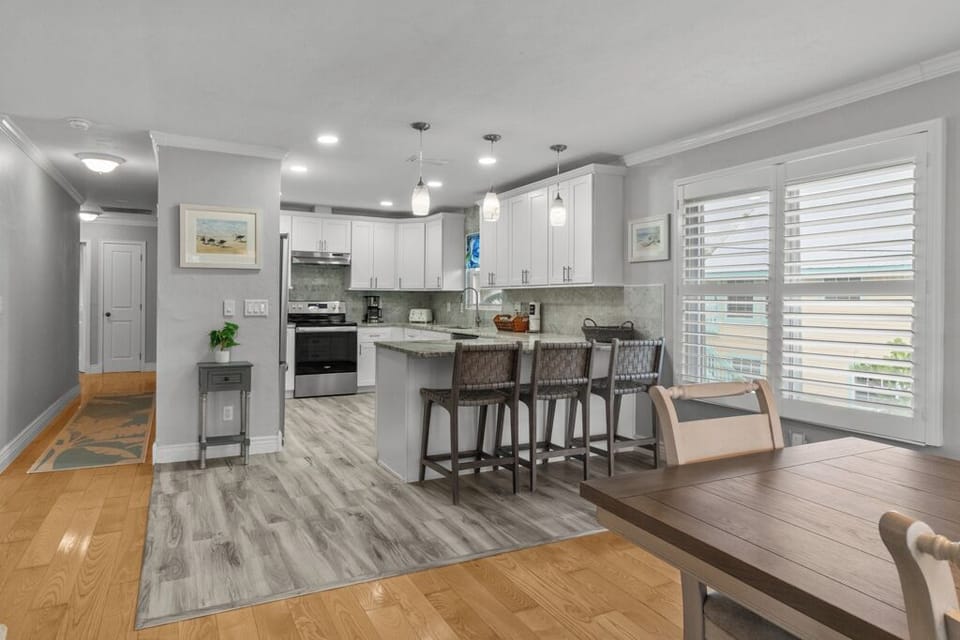Modern kitchen with stainless steel appliances, granite countertops, and all the essentials for effortless vacation cooking.